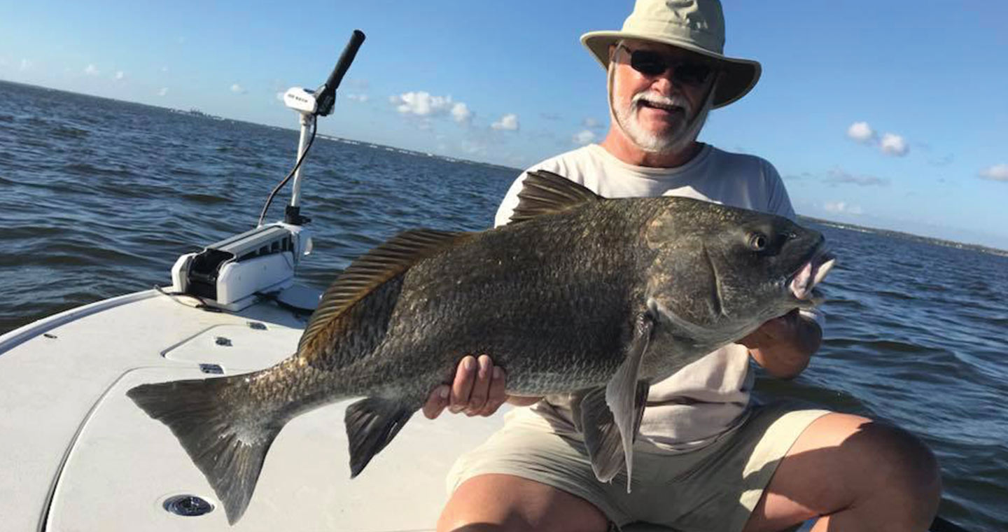 Man holding blak drum at the Bay Fishing Charter in the Mosquito Lagoon